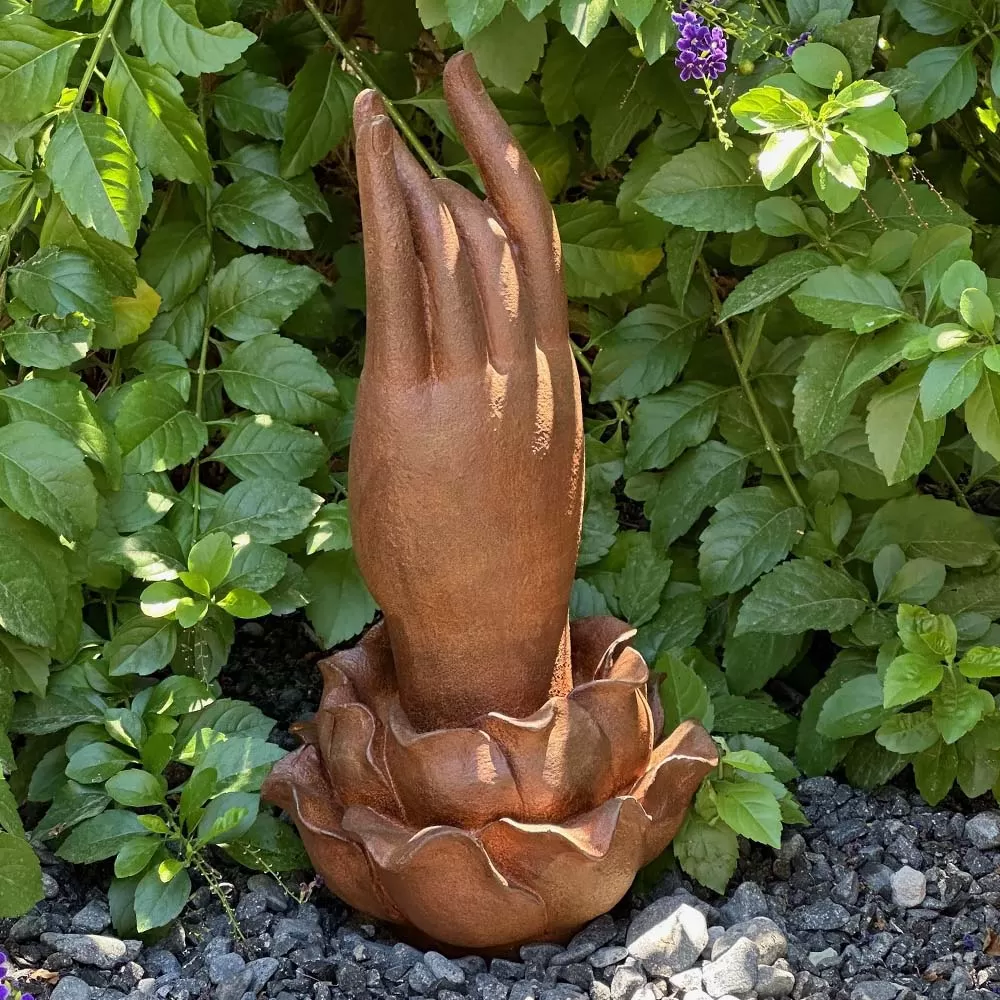 Cast Iron Hand of Buddha Rises from a Lotus Flower