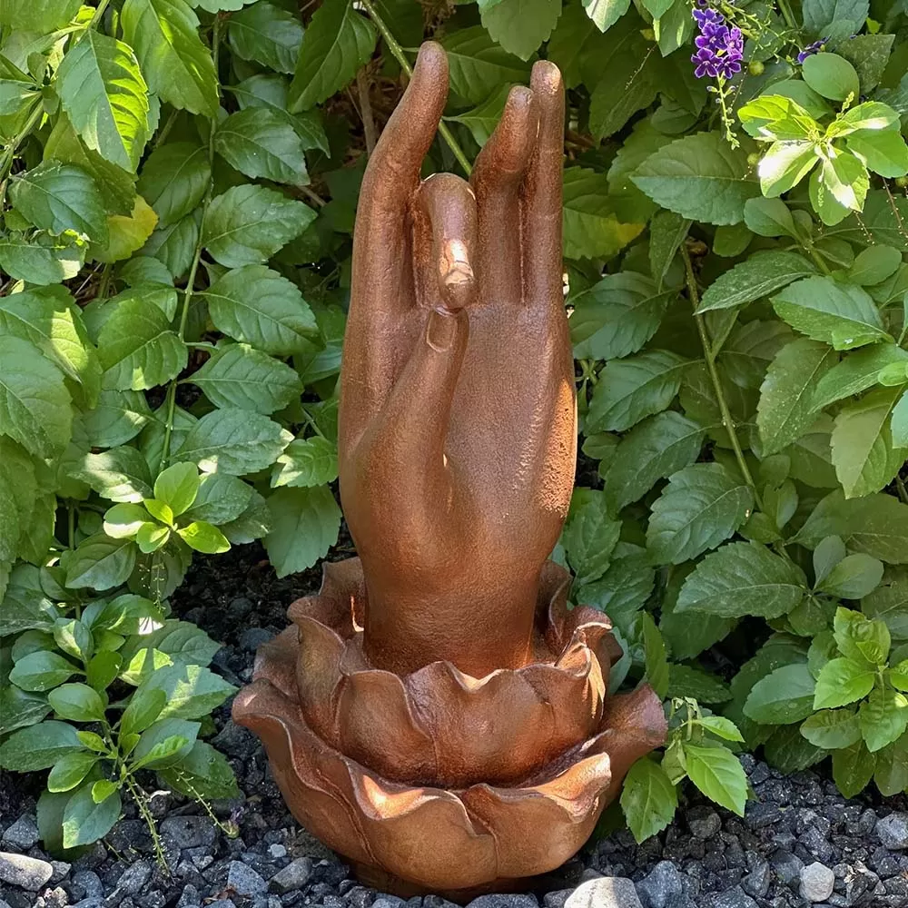 Cast Iron Hand of Buddha Rises from a Lotus Flower