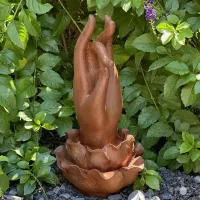 Cast Iron Hand of Buddha Rises from a Lotus Flower